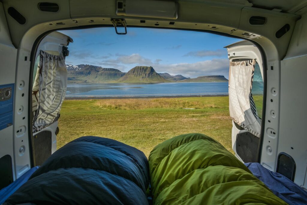 Breathtaking nature view from camper van by a lake in Iceland.